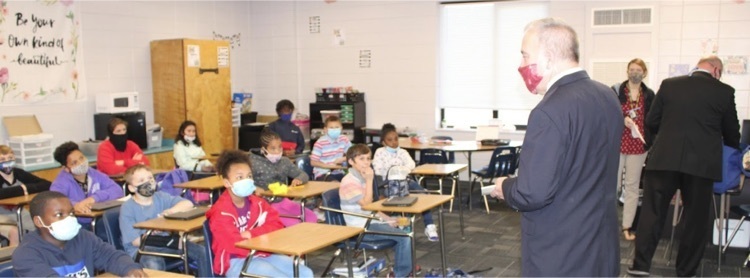 picture of superintendent Woods visiting a classroom