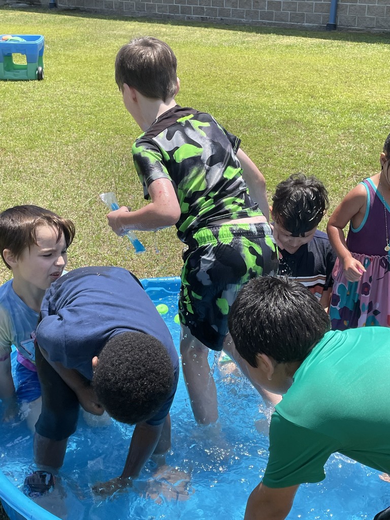 image of students playing in water